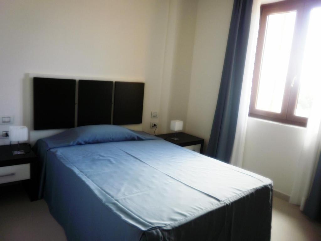 Buddi Hotel Platamona Chambre photo